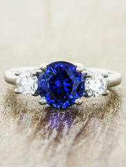 three stone diamond & sapphire engagement ring. caption:Customized with blue sapphire center stone