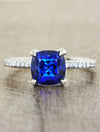 caption:Shown with cushion cut sapphire in platinum