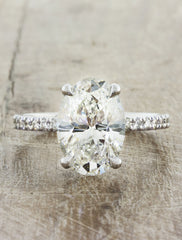 Classic solitaire pave diamond band caption:Shown with 2ct oval diamond option in 14k white gold