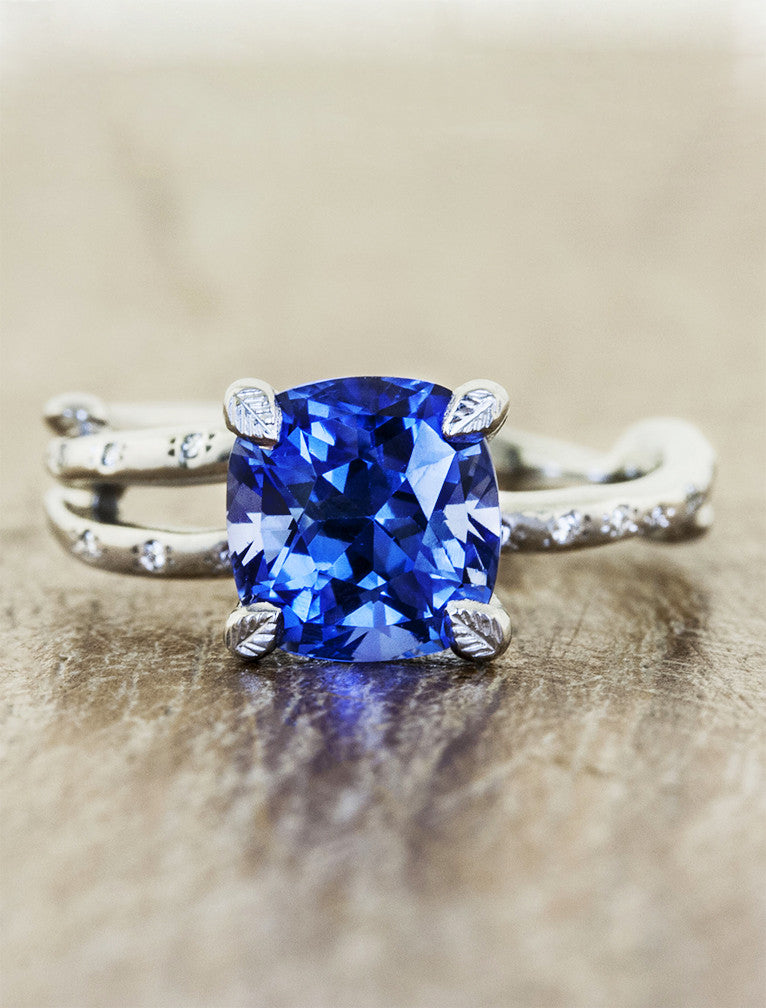 Nature inspired engagement ring leaf prongs. caption:Customized with an 1.75ct. Cushion Cut Sapphire 18k White Gold