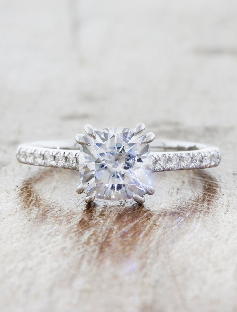 Solitaire with pave diamond band double prongs;caption: 1.25ct. Cushion Cut Diamond 14k White Gold