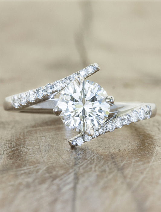 caption:Shown with 0.70ct round diamond in platinum