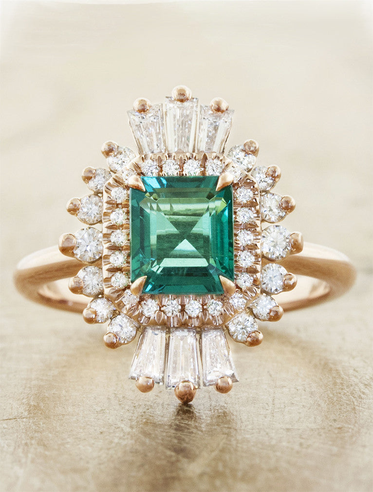 caption:Customized with an emerald center stone