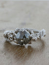 caption:Shown with a rose cut grey diamond in platinum