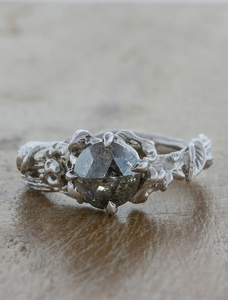 rough grey diamond, set in a leafy, organic band engagement ring. caption:Shown with a rose cut grey diamond