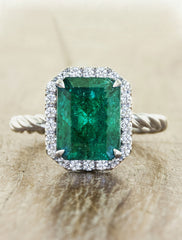emerald engagement ring, twisted band caption:emerald engagement ring, twisted band