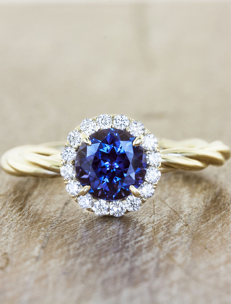 caption:Shown with round blue sapphire in yellow gold