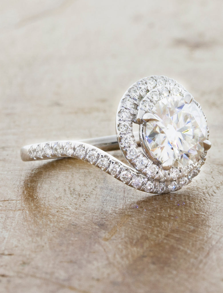 assymetrical swirling halo diamond engagement ring