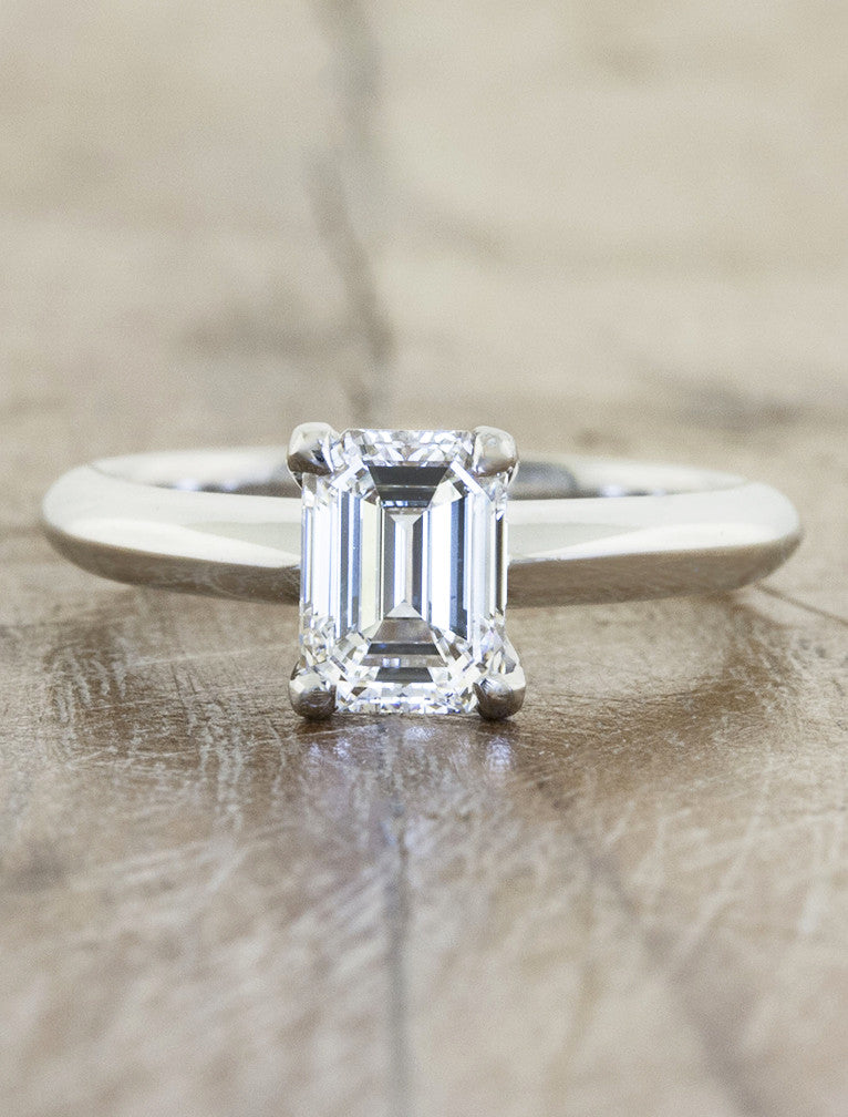 caption:Customized with emerald cut diamond & 4-prong setting in platinum