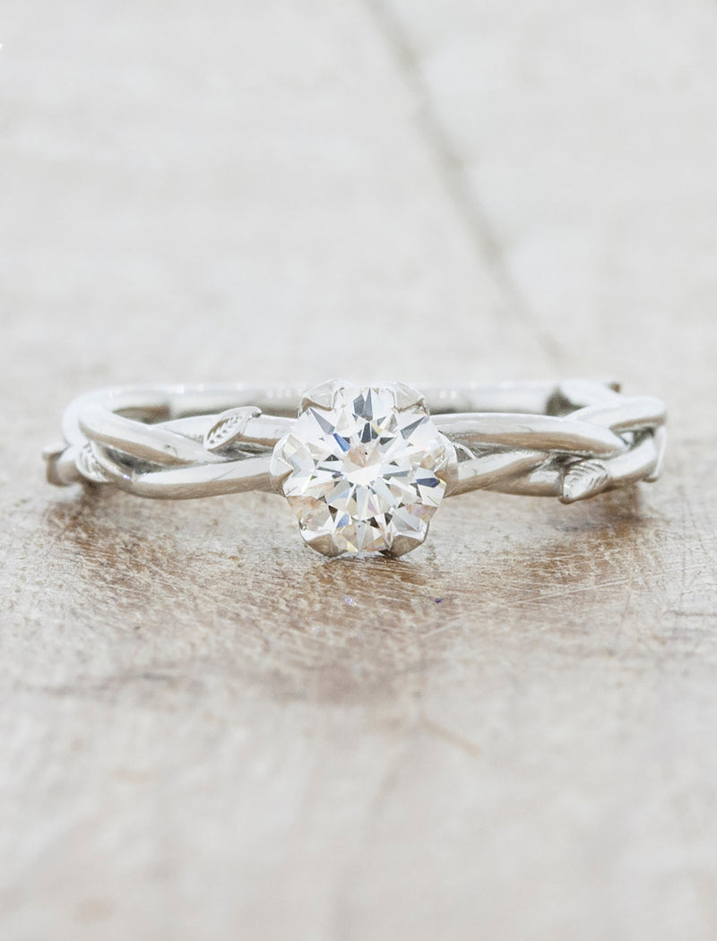 caption:Shown with 0.50ct round diamond in platinum