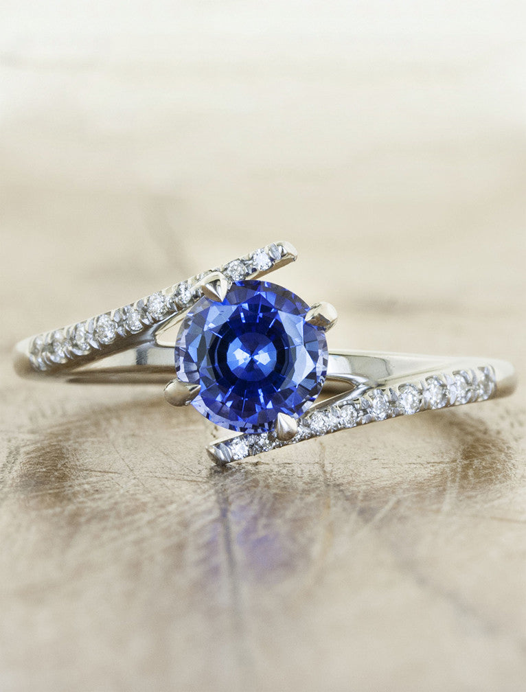 caption:Customized with round blue sapphire in platinum