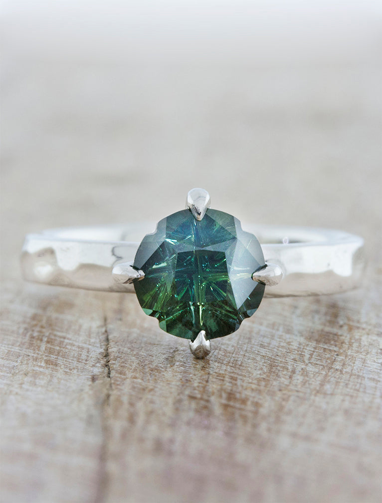 caption:Shown with Medicine Wheel cut Montana Sapphire in platinum with custom texture 