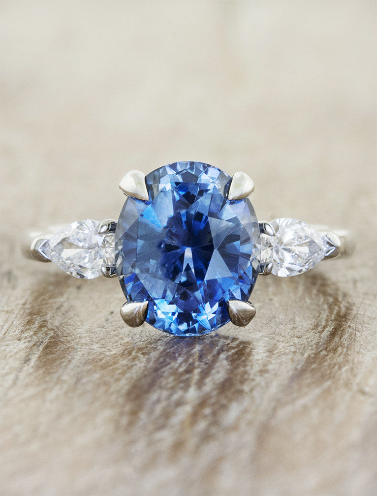 caption:Shown here with a blue sapphire center stone