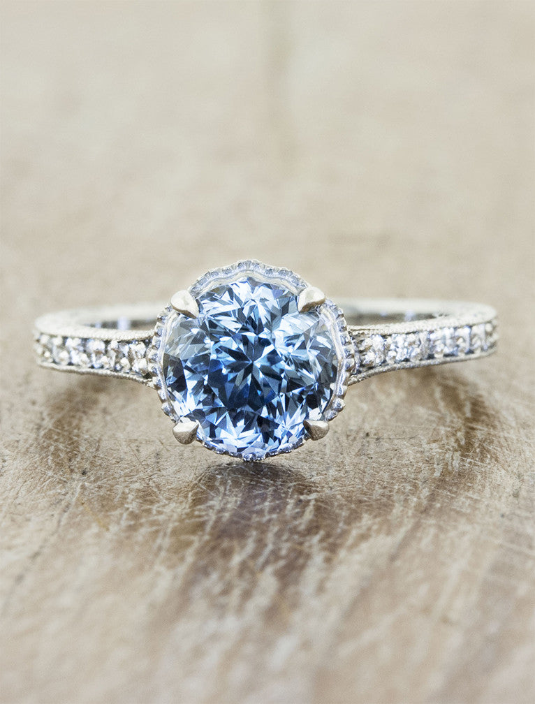Vintage inspired. caption:Customized with a 1.75ct. Round Sapphire, 14k White Gold