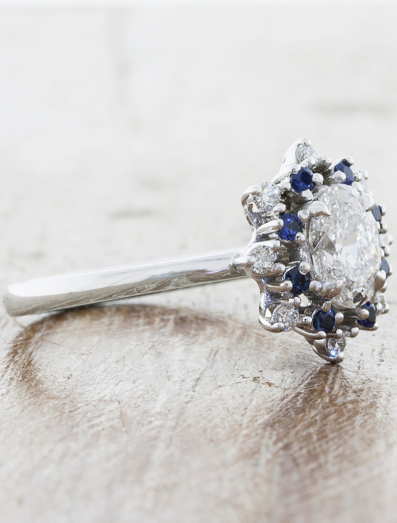 oval engagement ring with vintage inspired star halo with sapphires