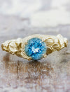caption:Customized with round aquamarine in yellow gold