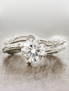 caption:Paired with Laurel engagement ring in platinum