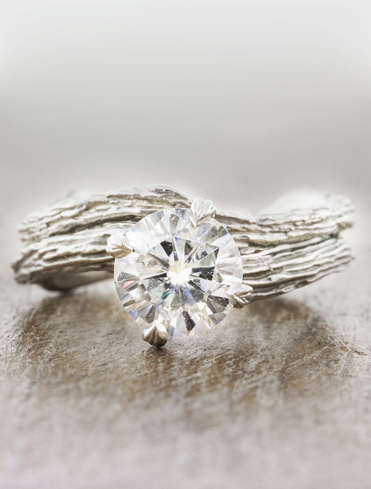 caption:Paired with Laurel engagement ring in platinum