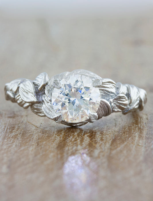 caption:Shown with round diamond in platinum