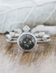 Nature Inspired Wedding Ring with Leaf Details. caption:Shown with Katie engagement ring with a 1.6ct salt and pepper diamond
