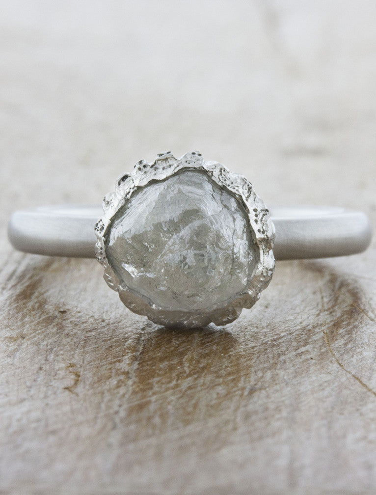 caption:Shown with 3.15ct rough cut diamond in platinum