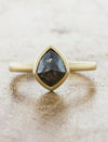 caption:Shown with 1.37ct kite cut grey diamond in 14k yellow gold