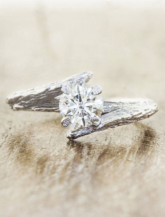 caption:Shown with 0.75ct round diamond in platinum