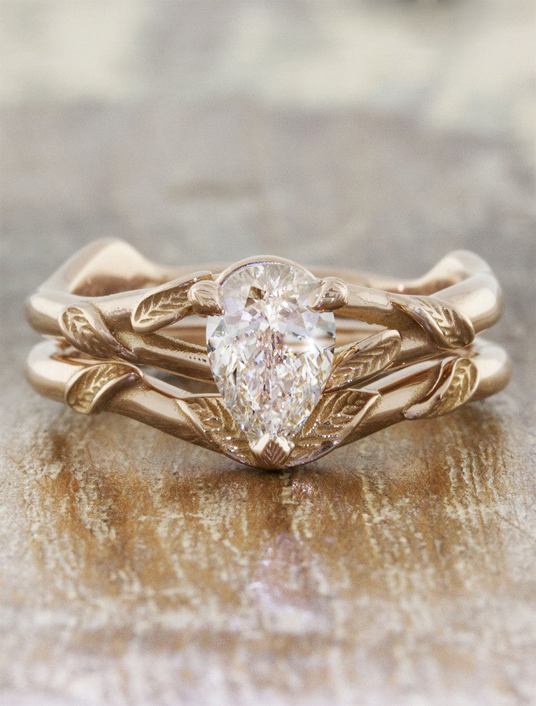 overlapping leaf design wedding ring - paired with pear shaped engagement ring