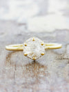 caption:Shown with hexagon rough cut diamond in 14k yellow gold