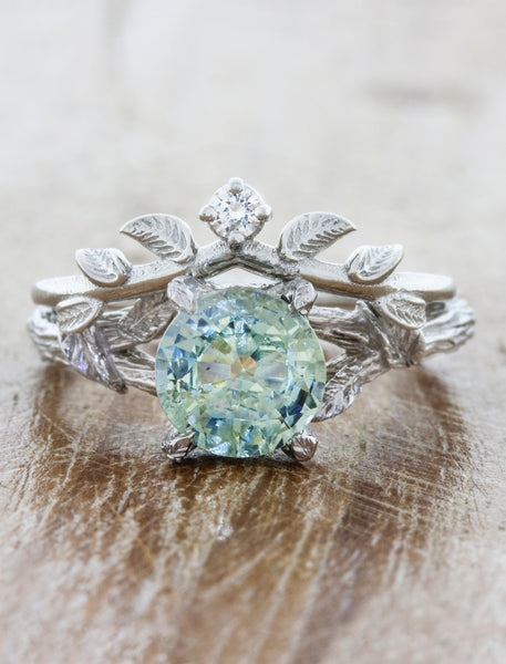 Nature Inspired Wedding Ring with Leaf Details. caption:Shown with Adelia engagement ring