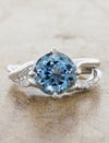 caption:Shown with rough light blue sapphire in platinum