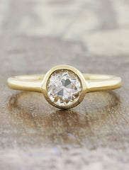 modern bezel set round diamond yellow gold ring. caption:Shown with 0.9 ct diamond option
