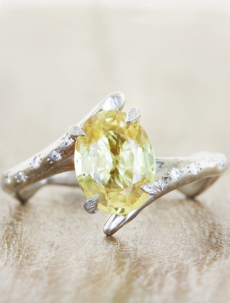 unique asymmetrical band oval yellow gemstone ring;caption:1.65ct. Oval Sapphire Platinum