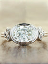 caption:Shown with oval diamond in platinum