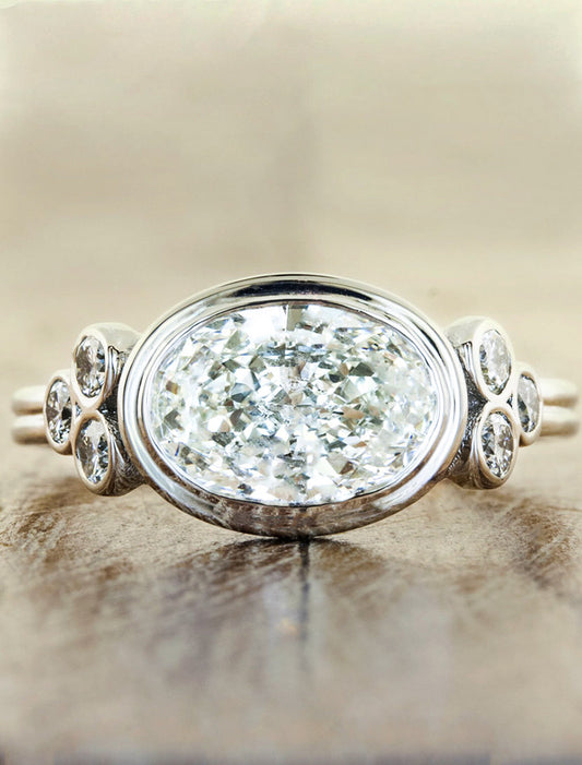 caption:Shown with oval diamond in platinum