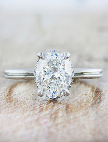 Nature inspired solitaire double band;caption:1.75ct. Oval Diamond Platinum