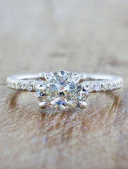 Classic solitaire pave diamond band caption:shown with customized horizontal 1.25ct oval diamond option in 14k white gold