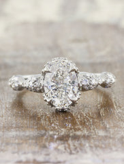 intricate oval diamond engagement ring, platinum band