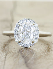Unique engagement ring halo;caption:1.25ct. Oval Diamond Platinum