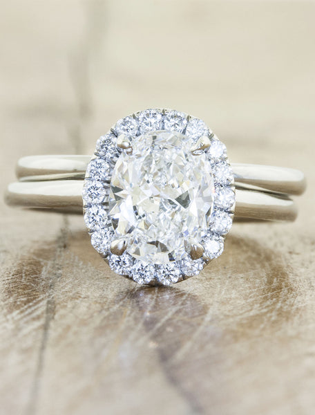 Unique engagement ring halo;caption:1.25ct. Oval Diamond Platinum paired with Lorena wedding band