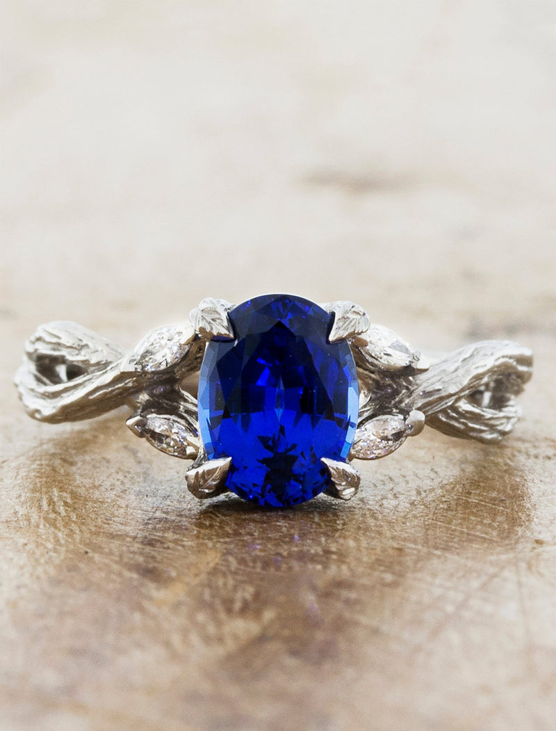 caption:Shown in platinum with oval blue sapphire
