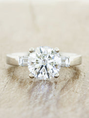3-stone baguette diamond engagement ring;caption:1.75ct. Round Diamond Platinum.  Customized with straight baguette side stones.