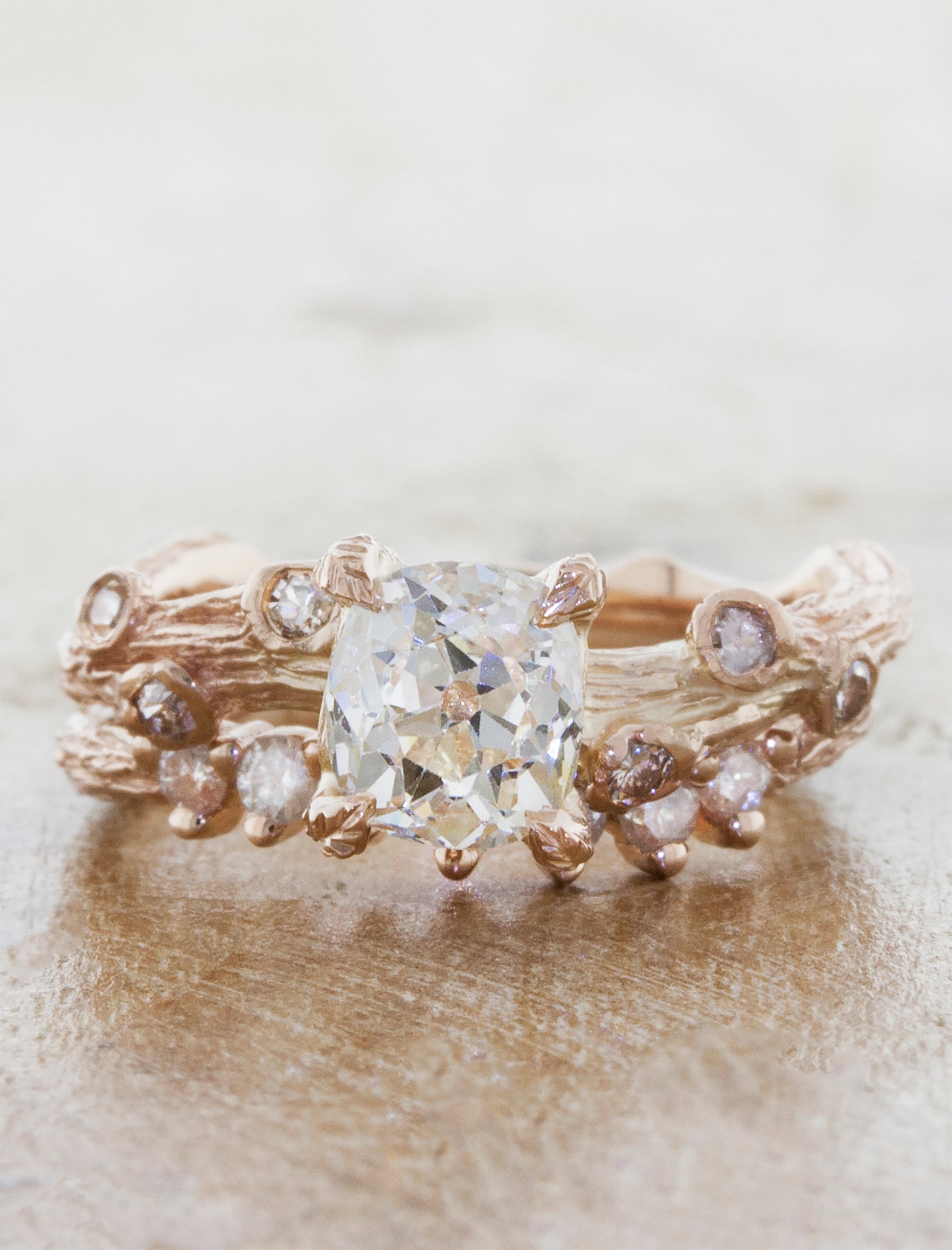 diamond studded bark textured wedding band paired with diamond ring