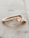 curved wedding band with trillion diamonds leaf detail