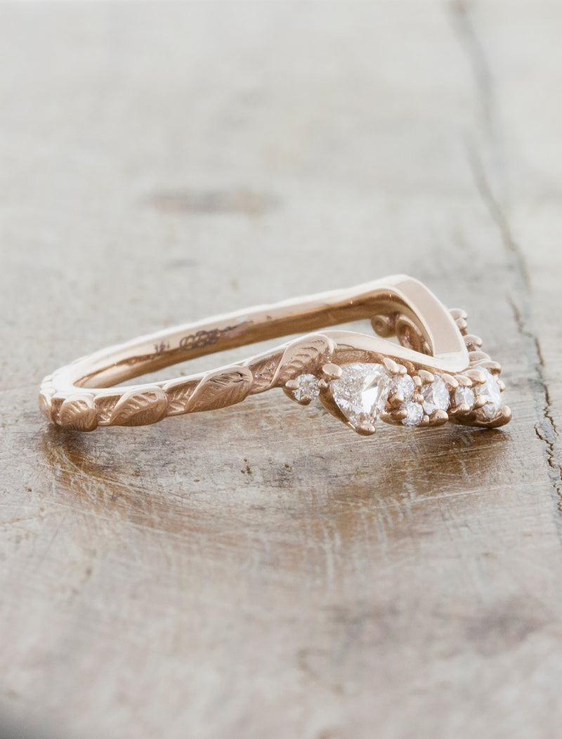 curved wedding band with trillion diamonds leaf detail