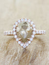caption:Customized with vertically set rustic pear diamond in 14k rose gold