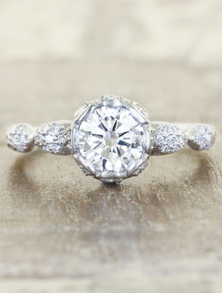 intricate round diamond engagement ring, platinum band