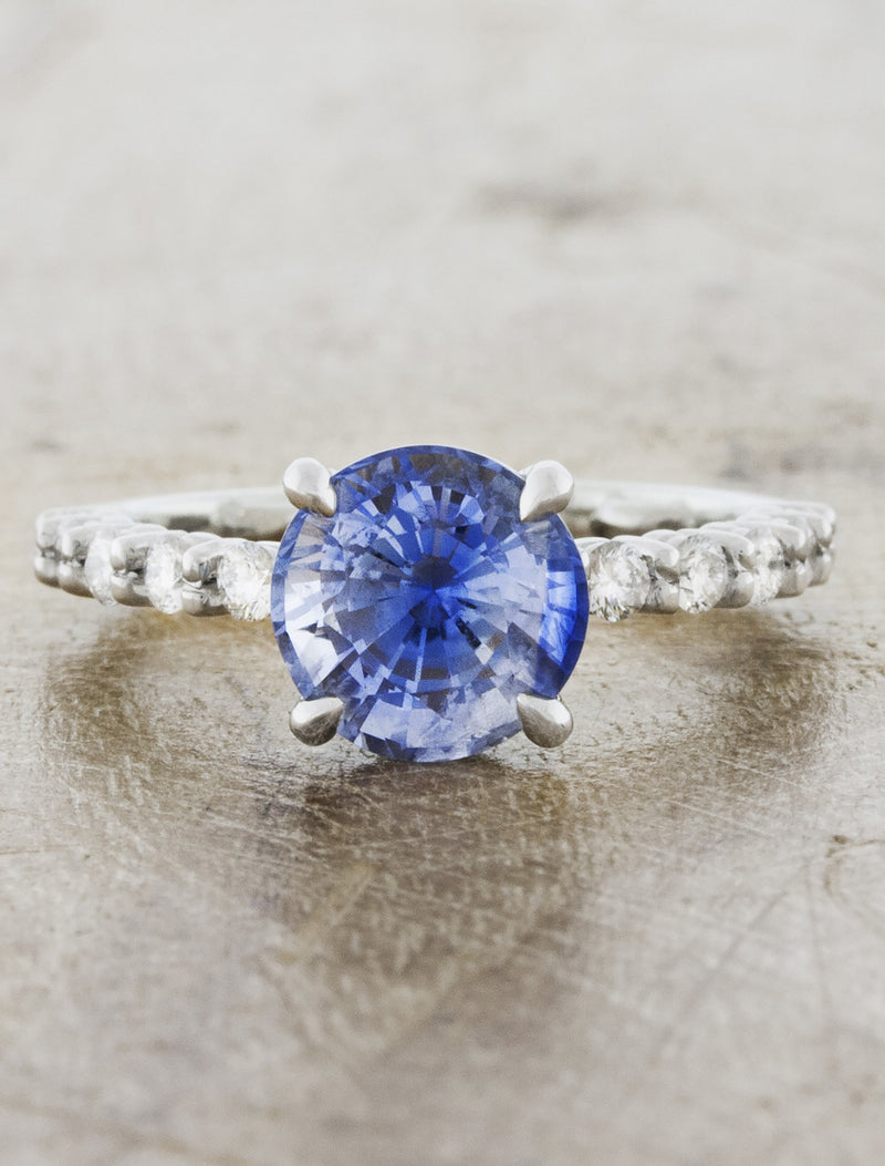 caption:Customized with a blue sapphire in platinum