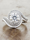 curved wedding band paired with halo engagement ring