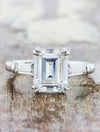 caption:Shown with 3ct emerald cut diamond in platinum